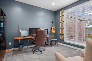 Office area featuring carpet floors and recessed lighting