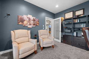 Sitting room featuring carpet floors and recessed lighting