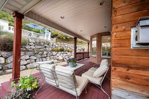 Wooden deck featuring an outdoor living space