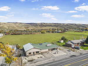 Aerial view of sparsely populated area with a mountain backdrop