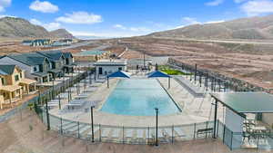 Community pool featuring a patio and a mountain view