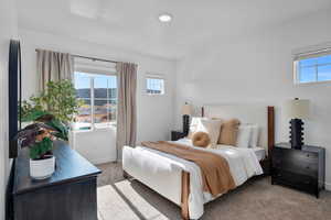 Bedroom featuring carpet flooring and baseboards
