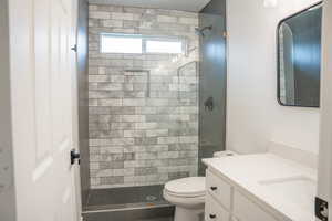 Bathroom featuring vanity and a shower stall