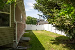 Fenced backyard with a gate