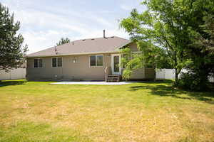 Rear view of house with roof with shingles, a patio area, a gate, and entry steps