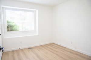 Spare room with light wood finished floors