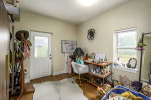Home office with light wood-type flooring and baseboards