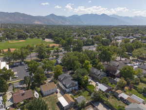 Aerial view of residential area featuring a mountainous background