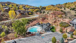 Aerial perspective of suburban area featuring a pool