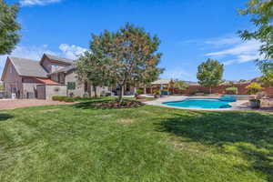 Fenced backyard featuring a patio area
