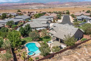 Aerial perspective of suburban area featuring a mountain backdrop