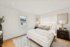 Bedroom with recessed lighting and light wood-type flooring