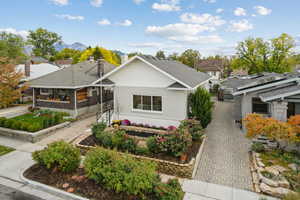 View of front of home featuring a chimney and a residential view
