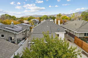 Aerial view of residential area featuring a mountainous background