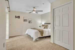 Newly carpeted master bedroom with large walk-in closet.
