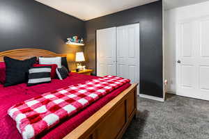 Bedroom featuring  carpet and a closet