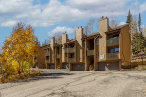 View of property with an attached garage
