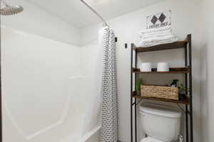 Private shower / bath combo and toilet