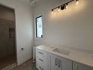 Full bathroom with vanity and a stall shower
