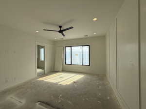 Empty room featuring ceiling fan and recessed lighting