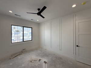 Empty room with ceiling fan, recessed lighting, and a smoke detector