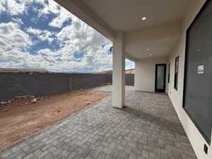 Fenced backyard featuring a patio area