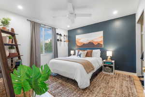 Bedroom with light wood finished floors, a ceiling fan, and recessed lighting
