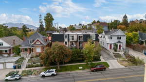 View of front of property with a residential view and stairs
