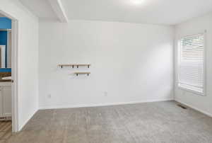 Spare room featuring light colored carpet