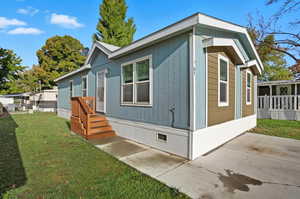 View of home's exterior with a lawn