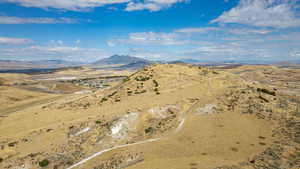 Overview of rural landscape with a mountainous background and a desert landscape