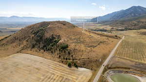 View of mountain background featuring rural landscape