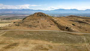 View of mountain backdrop featuring rural landscape