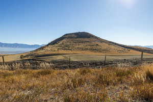 View of mountain backdrop featuring rural landscape