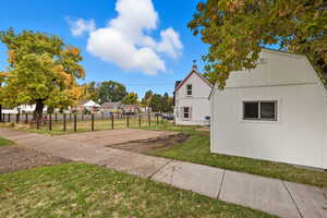 Side-Yard View with Driveway & Shed