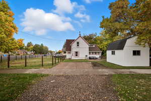 Side-Yard View with Driveway & Shed