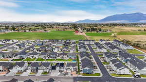 Aerial perspective of suburban area featuring a mountain backdrop