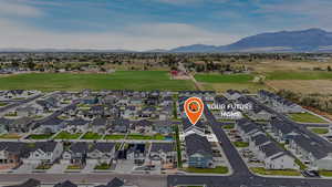 Aerial view of residential area with a mountain backdrop