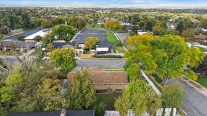 Aerial overview of property's location featuring nearby suburban area