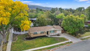 View of subject property featuring a mountainous background