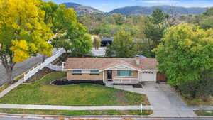 View of subject property with mountains