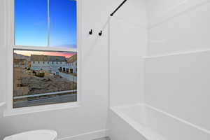 Full bath with shower / bath combination and toilet