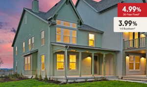 Back of house at dusk with stucco siding, a chimney, roof with shingles, a yard, and covered porch