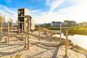 View of jungle gym with a residential view and a water and mountain view