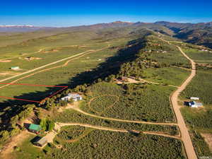 Overview of rural landscape featuring a mountain backdrop