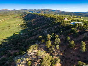 Aerial overview of property's location featuring mountains