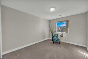 Unfurnished room with carpet flooring and baseboards