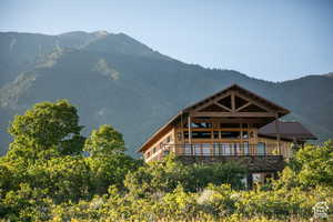 Back of property with a mountain view