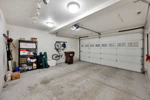 Garage featuring a garage door opener