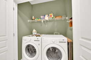Washroom featuring washer and clothes dryer